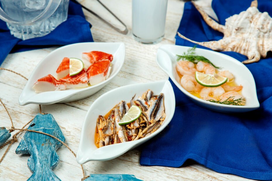 seafood side dishes with platter of shrimp, squids and fish